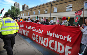 Protesters seen holding a red banner supporting the Jewish anti-Zionist Network in Cable Street during the rally. The 90th anniversary of the Battle of Cable Street is commemorated on Sunday 4 October 2026 in the east end of London. Despite the make-up having changed greatly over the last nine decades, thousands still marched through the streets to oppose Fascism and Zionism. In 1936, over 100,000 Jewish residents, Irish dockers, trade unionists, and local working-class communities stood shoulder to shoulder and repelled Sir Oswald Mosley's British Union of Fascists.