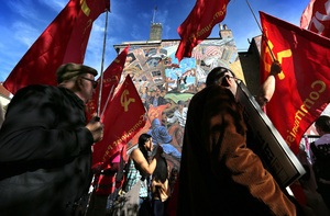 Communist party supporters seen holding flags while marching past the Cable Street mural during the rally. The 90th anniversary of the Battle of Cable Street is commemorated on Sunday 4 October 2026 in the east end of London. Despite the make-up having changed greatly over the last nine decades, thousands still marched through the streets to oppose Fascism and Zionism. In 1936, over 100,000 Jewish residents, Irish dockers, trade unionists, and local working-class communities stood shoulder to shoulder and repelled Sir Oswald Mosley's British Union of Fascists.