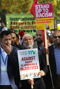 A supporter of Muslim Voices seen holding a sign saying ‘Against Racism Islamophobia & injustices’; during the rally. The 90th anniversary of the Battle of Cable Street is commemorated on Sunday 4 October 2026 in the east end of London. Despite the make-up having changed greatly over the last nine decades, thousands still marched through the streets to oppose Fascism and Zionism. In 1936, over 100,000 Jewish residents, Irish dockers, trade unionists, and local working-class communities stood shoulder to shoulder and repelled Sir Oswald Mosley's British Union of Fascists.