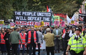 A sign saying ‘The People United Will Defeat The Nazis. Ans Fascists’ seen during the rally. The 90th anniversary of the Battle of Cable Street is commemorated on Sunday 4 October 2026 in the east end of London. Despite the make-up having changed greatly over the last nine decades, thousands still marched through the streets to oppose Fascism and Zionism. In 1936, over 100,000 Jewish residents, Irish dockers, trade unionists, and local working-class communities stood shoulder to shoulder and repelled Sir Oswald Mosley's British Union of Fascists.
