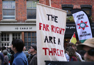 A banner with a message in capital letters "The far right are a threat" seen during the protest. The 90th anniversary of the Battle of Cable Street is commemorated on Sunday 4 October 2026 in the east end of London. Despite the make-up having changed greatly over the last nine decades, thousands still marched through the streets to oppose Fascism and Zionism. In 1936, over 100,000 Jewish residents, Irish dockers, trade unionists, and local working-class communities stood shoulder to shoulder and repelled Sir Oswald Mosley's British Union of Fascists.