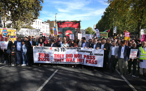 Supporters from diverse backgrounds seen march behind a 90th anniversary banner during the rally. The 90th anniversary of the Battle of Cable Street is commemorated on Sunday 4 October 2026 in the east end of London. Despite the make-up having changed greatly over the last nine decades, thousands still marched through the streets to oppose Fascism and Zionism. In 1936, over 100,000 Jewish residents, Irish dockers, trade unionists, and local working-class communities stood shoulder to shoulder and repelled Sir Oswald Mosley's British Union of Fascists.