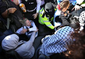 A police officer seen tussling with protesters who try to prevent the arrest of a colleague during the rally. The 90th anniversary of the Battle of Cable Street is commemorated on Sunday 4 October 2026 in the east end of London. Despite the make-up having changed greatly over the last nine decades, thousands still marched through the streets to oppose Fascism and Zionism. In 1936, over 100,000 Jewish residents, Irish dockers, trade unionists, and local working-class communities stood shoulder to shoulder and repelled Sir Oswald Mosley's British Union of Fascists.