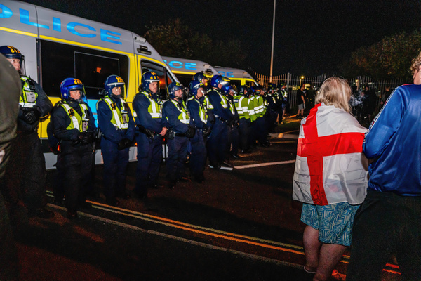 A cordon of police seen separating Gosport locals and protesters from the marina where boats carrying migrants arrive. Hundreds of anti-migrant protesters once again blockaded Gosport Marina to prevent small boats carrying migrants from disembarking there. A Section 14 dispersal order was imposed on the whole town to maintain order.