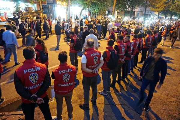 Demonstrators protesting the expulsion of PKK leader Abdullah Öcalan from Syria and Turkish police officers surrounding them are seen. A protest was held in the city of Diyarbakir in Turkey, by the Peoples' Equality and Democracy Party (DEM Party) and various Kurdish organizations and parties to mark the anniversary of PKK leader Abdullah Ocalan’s expulsion from Syria on October 9, 1998. Ocalan, the leader of the armed Kurdish organization the Kurdistan Workers' Party (PKK), was captured in Kenya, taken to Turkey, and arrested after being expelled from Syria. Imprisoned for 27 years, Ocalan has been conducting peace talks with the Turkish state for the past two years. Within the framework of these talks, Ocalan had decided to disarm his organization.