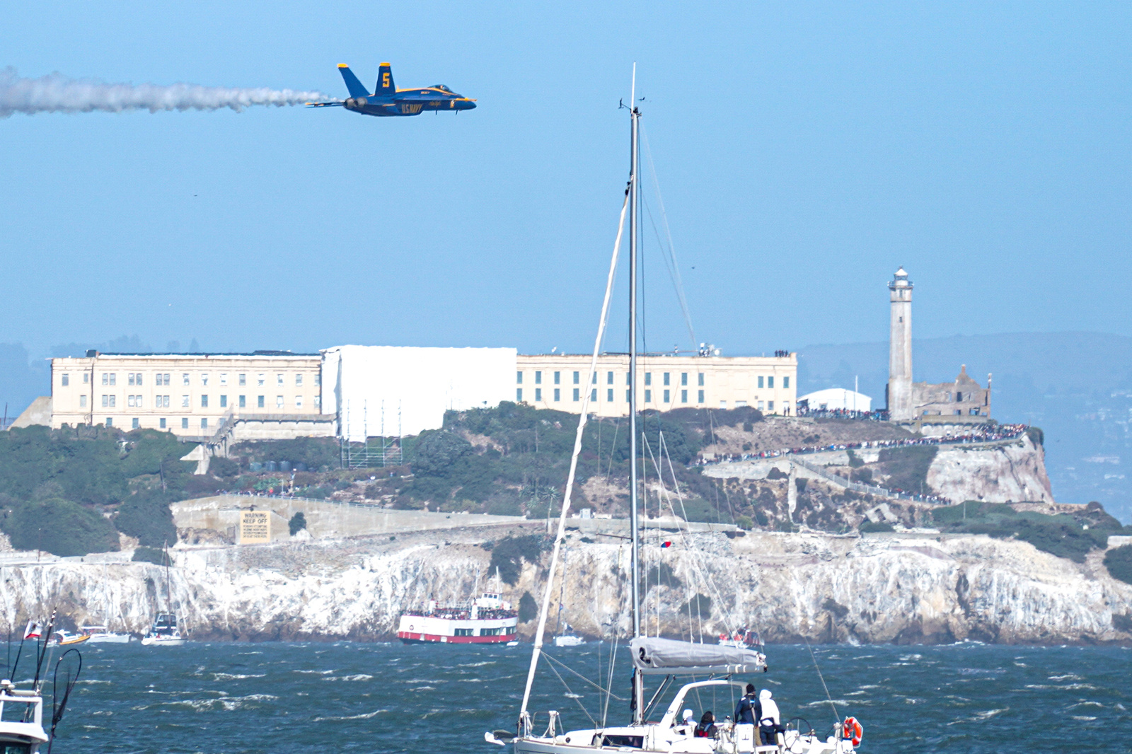 A fighter jet of Blue Angels performs over the skies of San Francisco. Crowds gather along the waterfront to watch the San Francisco Fleet Week Air Show as aircraft, including the U.S. Navy Blue Angels, performed in the skies over the city. The annual event is part of San Francisco Fleet Week, which celebrates the U.S. military and honors the men and women serving in the armed forces.