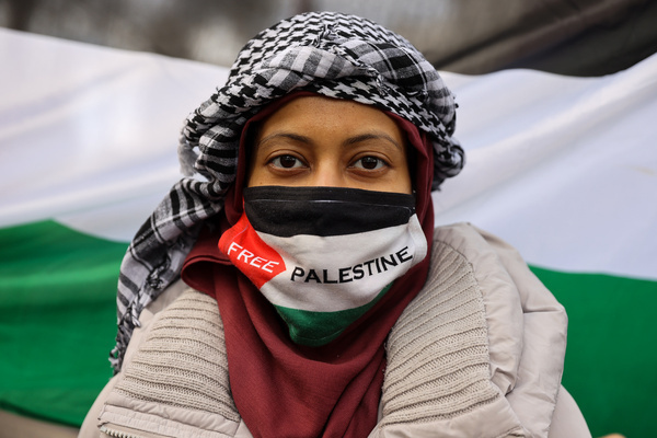 A pro-Palestine supporter takes part in the National March for Palestine in central London, carrying placards and Palestinian flags and calling for Palestinian rights and an end to the conflict in Gaza, three days after the third anniversary of the 7 October attacks on Israel. The march took place amid ongoing protests over the conflict in Gaza, with demonstrators calling for Palestinian rights and an end to the war.
