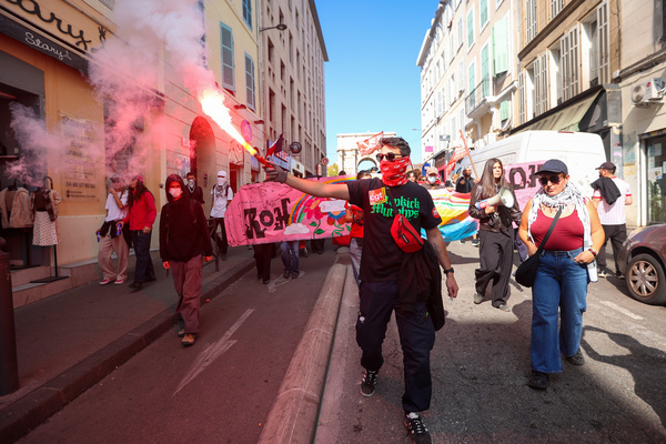 A protester seen holding a smoke flare during the high school students protest. Several thousand high school and university students took to the streets of Marseille to protest against the deterioration of teaching conditions that has been affecting high schools for several years.