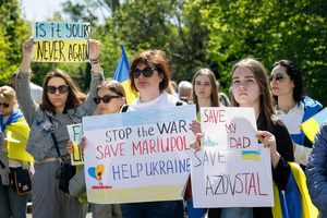 Women hold placards expressing their opinion as they take part during a protest at the Soviet soldiers cemetery in Warsaw on Victory day. On the 77th anniversary of the Red Army victory over Nazi Germany Ukrainian activists performed at the Soviet soldiers cemetery in Warsaw as they protested against Russian invasion of Ukraine. Activists banned the Russian delegation headed by Sergey Andreev, the Ambassador of the Russian Federation in Poland, from entering the Cemetery. During that attempt diplomats were doused with fake blood by the Ukrainian activists.