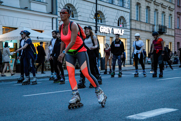 A woman roller skating during the "Nightskating Warsaw" event in the center of the city. Night skating Warsaw is a popular series of night roller skating rides along the city. It is a meeting of people who adore roller-skating not only as a sport but for fun regardless of age. The track is about 25 km. According to organizers, there were about 1500 participants.