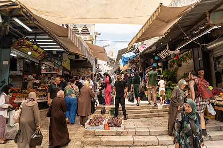 Muslim vendors and clients at the Damascus Gate old city market during Shabbat. Jerusalem is the capital of Israel, it is considered one of the oldest city in the world, and extremely important for Jewish, Christians and Muslims worshippers. All those religions fought for this city and now try to coexist. The Israeli government has the full control of it.
