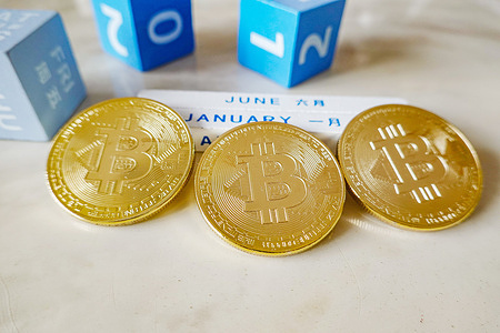 In this photo illustration, three models of the virtual currency Bitcoin are seen displayed.
