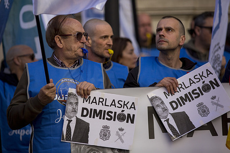 Protesters from the Spanish National Police unions hold placards during a demonstration demanding the resignation of Interior Minister Fernando Grande-Marlaska and the Director General of the National Police, Francisco Pardo Piqueras, following the complaint against José Ángel González for alleged sexual assault of a subordinate.