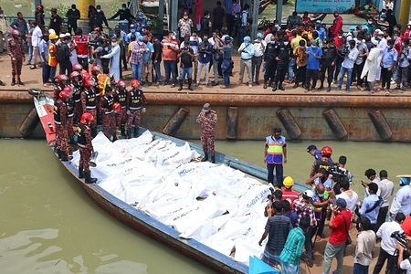 (EDITOR'S NOTE: Image depicts death)
Recovered bodies of launch capsize victims collected from Buriganga River.
At least 30 people died and a dozen are missing after a ferry capsized and sank on June 29 in the Bangladeshi capital Dhaka following a collision with another vessel, rescue officials said.
