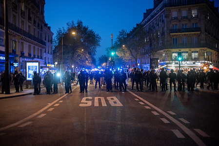 Police officers walk towards the crowd during the International Women's Day demonstration in Paris. Hundreds of thousands gathered on the Place de la Bataille-de-Stalingrad in Paris to march to the Place de la Republique. Protesters celebrated the International Women's Day and demanded to stop fascism and domestic violence. Because of the numbers of domestic violence victims is increasing while the number of femicides is decreasing but remains high according to the Interior Ministry in France.