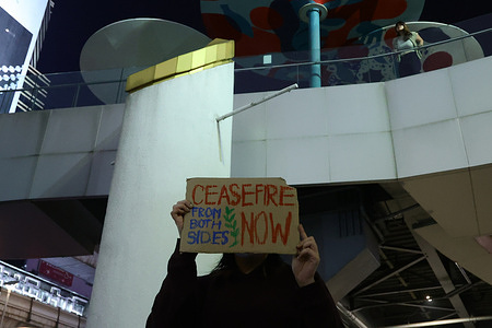 A protester holds a placard during the demonstration. A group of Thai people gathered holding ‘Stop the War’ signs to call for an end to the fighting between Thailand and Cambodia, which has been ongoing for more than 10 days, in front of the Bangkok Art and Culture Centre in Bangkok, Thailand.