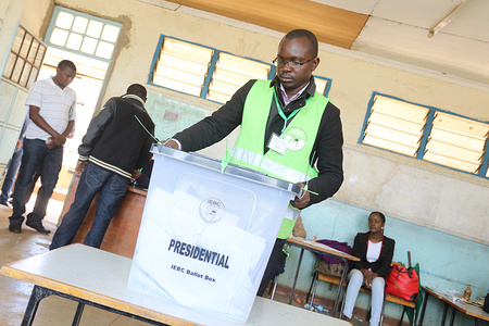 Kenya’s Independent Electoral and Boundaries Commission officer preparing ballot box at Moi Avenue Primary School polling station in Nairobi during the repeat presidential election. National Super Alliance (NASA) opposition coalition leader Raila Odinga asked his followers to boycott the election.