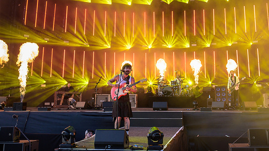 Simon Neil (C), Ben Johnson (back center), and James Johnson (R) of indie rock band Biffy Clyro are seen performing live on stage at the TRNSMT music festival. The TRNSMT music festival began in Glasgow in 2017 as a successor to T in the Park. Organized by DF Concerts, it quickly became a major annual event in Scotland, drawing big-name artists and large crowds—except in 2020 due to COVID-19.