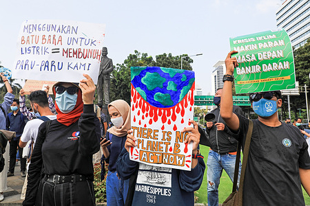 Activists holding placards expressing their opinion as they take part in a rally ahead of World Environment Day.
World Environment Day is celebrated annually on 05 June and aims to encourage awareness and environmental protection.