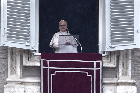 Pope Leo XIV leads the Angelus prayer from the window of his study overlooking St. Peter's Square at the Vatican.