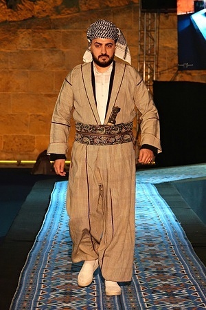 A Kurdish man is seen displaying a garment called Shal u Shapik, which is made from a special fabric and worn in a large area inhabited by Kurds. In order to keep their traditional dresses alive, the 3rd Traditional Kurdish Dresses Festival was held in Zakho city of the Federal Kurdistan Region of Iraq. Various traditional dresses worn by Kurds living in Iraq, Turkey, Syria and Iran were introduced at the stands opened at the festival held in the city of Zakho on the Turkish-Iraqi border on April 29-30. Famous Kurdish artists and music groups also performed at the festival.