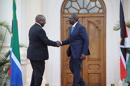 Kenya's president William Ruto and South African president Cyril Ramaphosa shake hands during a joint press briefing at State House in Nairobi. The South African president is in Kenya for a two day state visit.