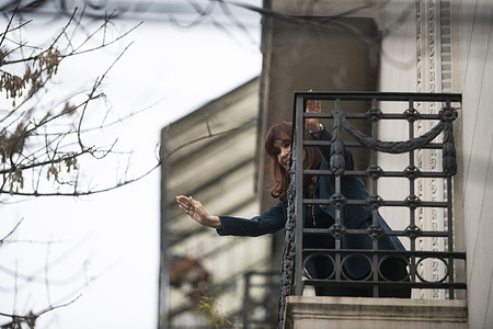 Former Argentine President Cristina Fernández de Kirchner greets supporters from the balcony of her residence in Buenos Aires three days after the Supreme Court upheld her corruption conviction.