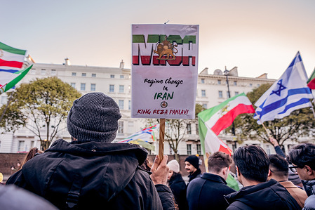 A protestor holds a placard calling for the return of exiled Crown Prince of Iran, Reza Pahlavi during the rally. Hundreds joined a public rally in support of the protestors in Iran, calling for regime change from clerical rule and for Ayatollah Ali Khamenei to step down in place of exile Crown Prince Reza Pahlavi.