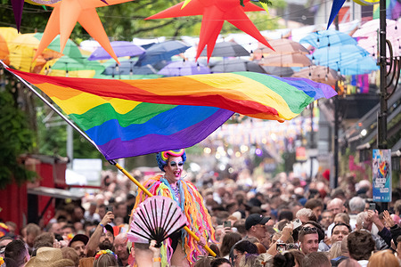 Drag artist waves a gay pride flag on Canal street at the centre of the Pride events during the Manchester Pride 2023. Manchester Pride is preparing to enter administration reports. 'The Mill'. Manchester Pride Ltd has reportedly run out of money and can no longer pay its bills. According to the board of trustees, “Manchester Pride is currently in the process of determining the best way forward with our legal and financial advisers.” The aim is to provide additional communications by Wednesday 22nd October. Included in this year's act were Nelly Furtado, Olly Alexander, and Tulisa.