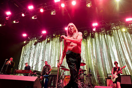 Shirtless American singer, musician, songwriter, actor James Newell Osterberg Jr., known professionally as Iggy Pop, seen performing live on stage at The Victoria Warehouse Manchester UK.