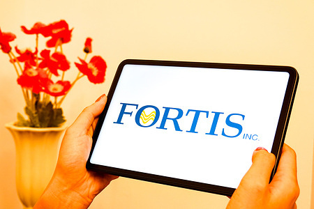 In this photo illustration, the logo of Fortis Inc. is displayed on the screen of a tablet.