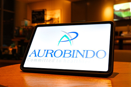 In this photo illustration, the Aurobindo logo is displayed on the screen of a tablet.