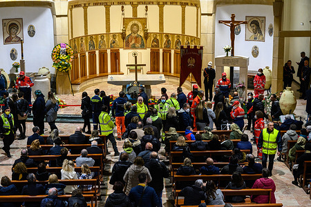 People stand in a queue to pay homage to Biagio Conte, the founder of Hope and Charity Mission, during his funeral. Worshippers pay homage to Biagio Conte, a Catholic lay missionary who was the founder of Hope and Charity Mission (Missione Speranza e Carità) in 1993 for the poor and homeless in Palermo. Conte died of cancer at 59 years on January 12th, 2023, in his native city, and his body was exposed at the church of Missione Speranza e Carità. His funeral will be held at the Cathedral of Palermo.