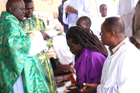 Faithful of Legio Maria, an African initiated church, Kibera attend a service as they pray for peace after the country went for elections on 9th August 2022 to elect political leadership. Kenya is waiting for the results of a close-run election with candidates William Ruto and Raila Odinga running almost neck and neck. The Electoral body IEBC in Nairobi is currently tallying results which have to be released within a seven-day period which elapses on Tuesday 16th August 2022. In the past Kenya has experienced post-poll violence.