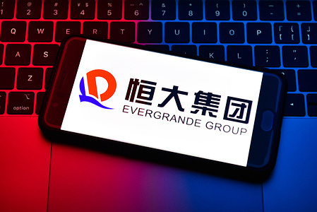 In this photo illustration the Evergrande Group logo is seen displayed on a smartphone.
The Evergrande Group or the Evergrande Real Estate Group (previously Hengda Group) is China's second-largest property developer by sales. It is based in southern China's Guangdong Province, and sells apartments mostly to upper and middle-income dwellers.