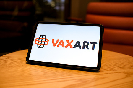 In this photo illustration, the Vaxart logo is seen displayed on the screen of a tablet.