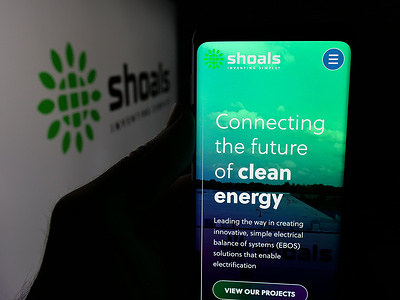 In this photo illustration, a smartphone with the web page of US company Shoals Technologies Group Inc.is seen displayed on screen in front of logo.