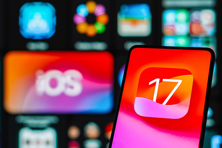 In this photo illustration, the iOS 17 logo is displayed on a smartphone screen.