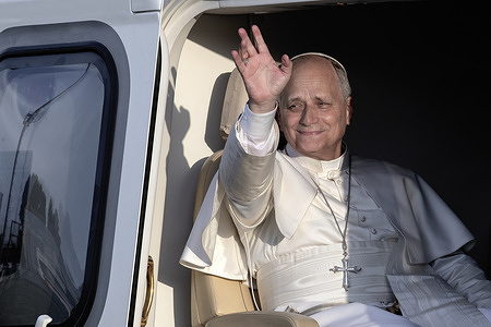 Pope Leo XIV waves from the helicopter before departing for the Vatican at the end of his pastoral visit to Sant'Angelo Lodigiano, in the province of Lodi, northern Italy.