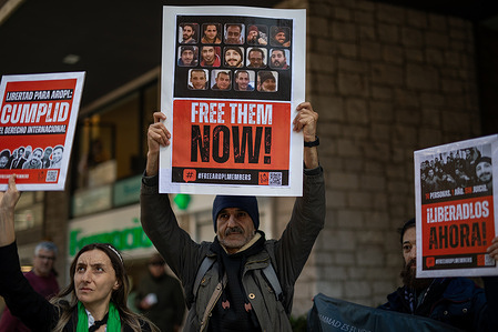 Followers of the Ahmadi Religion of Peace and Light hold placards during the rally. Followers of the Ahmadi Religion of Peace and Light based in Madrid gathered in front of the Egyptian embassy in the Spanish capital as part of a campaign for the release of 14 members of the Ahmadi Religion of Peace and Light who have been detained in Egypt for more than seven months, allegedly "for not committing any crime, but solely for their faith."