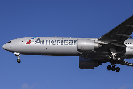 American Airlines Boeing 777-300 with registration N717AN is landing at London Heathrow Airport ( LHR / EGLL ) in England, UK. The airplane is a Boeing 777-323(ER), Extended Range and is equipped with 2 x GE90 , the largest passenger jet engines for an aircraft. American Airlines with code AA or AAL is the largest airline in the world, part of Oneworld aviation alliance, based in Fort Worth in Texas, US.