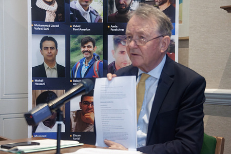 Professor Lord Alton of Liverpool holds evidence of Iran’s grave human rights abuses during a press conference at the UK Parliament. He called for international accountability mechanisms to prosecute regime officials for crimes against humanity, and urged official recognition of the NCRI as the democratic alternative. In a powerful press conference held at the UK Parliament, British lawmakers, legal experts, and representatives of the Iranian opposition (NCRI) warned of a looming massacre targeting political prisoners in Iran. Speakers condemned the alarming rise in executions, particularly of PMOI/MEK members, and urged the UK Government to take immediate action. The event called for international accountability, UN referral of Iran’s human rights violations, and recognition of the NCRI as the democratic alternative to the clerical regime.