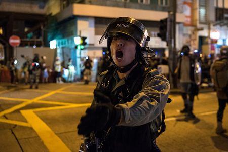 A riot police officer yells at journalists to back away from the scene of an arrest during the demonstration.
Protesters yet again occupied streets near Prince Edward Station in response to police storming the station the previous week. Protesters have continued to demand the MTR Corporation to release CCTV footage of the incident and have returned to protest at the station almost every night since. Police fired several beanbag rounds before conducting a dispersal operation and making several arrests.