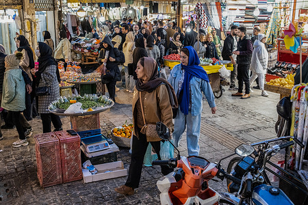 A view of the outdoor market where people are walking around and shopping. Rasht is the capital of Gilan Province and the most populous city in northern Iran. U.S. economic sanctions have led to a shrinking economy, causing economic difficulties for the people and reducing their purchasing power.