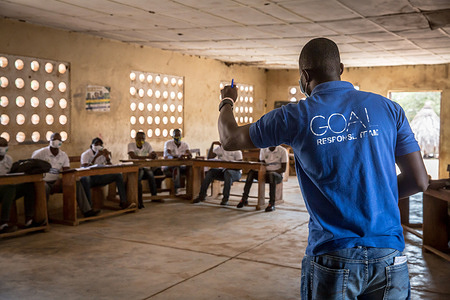 A facilitator from the charity Goal leads a training for "community mobilisers", who will help their areas create action plans to focus on what to do if Ebola spreads across the border to Sierra Leone.
The latest Ebola outbreak in Guinea was declared in February 2021 and local communities are working on prevention strategies to try and stop Ebola spreading to Sierra Leone.