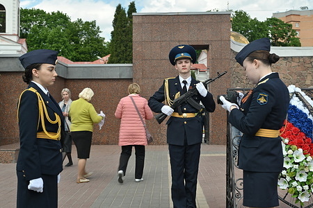 Schoolchildren from the militarized class dressed in military clothes take photos near the Memorial Complex to the Soldiers of the Great Patriotic War during the commemoration of the 80th anniversary of the Soviet Union's victory over Nazi Germany in World War II.
