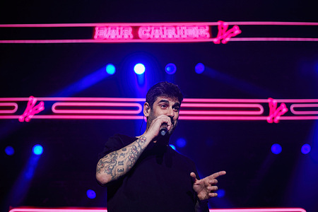 The Spanish singer-songwriter and composer of pop, rock, and rumba music Ramón Melendi Espina, known artistically as Melendi, performs on the stage of the Navarra Arena pavilion in Pamplona during the concert offered tonight as part of his tour “20 años sin noticias” (“20 years without news”).