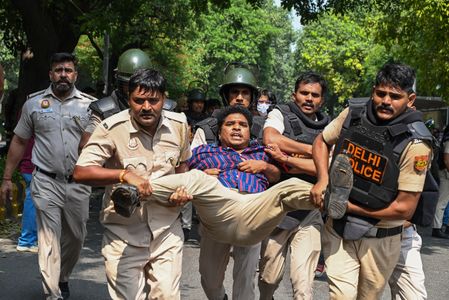 Several police personnel detain a CJP protester during a protest against Chief Election Commissioner Gyanesh Kumar near Jantar Mantar. CJP (Cockroach Janta Party), which represents India’s Gen Z, organised the protest against Chief Election Commissioner Gyanesh Kumar over alleged irregularities in voter-list revisions. The protesters demanded his resignation. Almost all Indian opposition parties participated in the protest. The demonstration was planned to be held at Jantar Mantar in New Delhi. Delhi Police denied permission, citing public safety and law-and-order concerns. On Saturday, police detained protesters and several political leaders as security was tightened across parts of the capital.