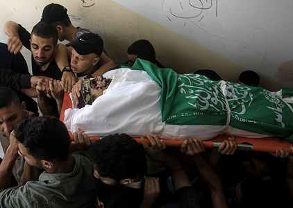 (EDITOR'S NOTE: Image depicts death)
Palestinian mourners carry the body of Baraa Al-Zard during his funeral ceremony. The Palestinian Ministry of Health said that at least 5 people were killed and a number of others were wounded as a result of the explosion that occurred near the separation fence along the border with Israel, east of Gaza City.
