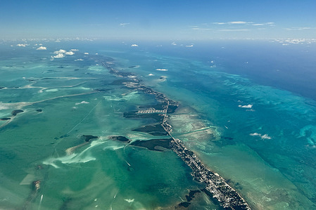 The Florida Keys are seen from above. The island chain stretches 120 miles South from mainland Florida, connecting Key Largo to Key West.